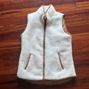 Cream with dark tan outline, Sherpa like vest.